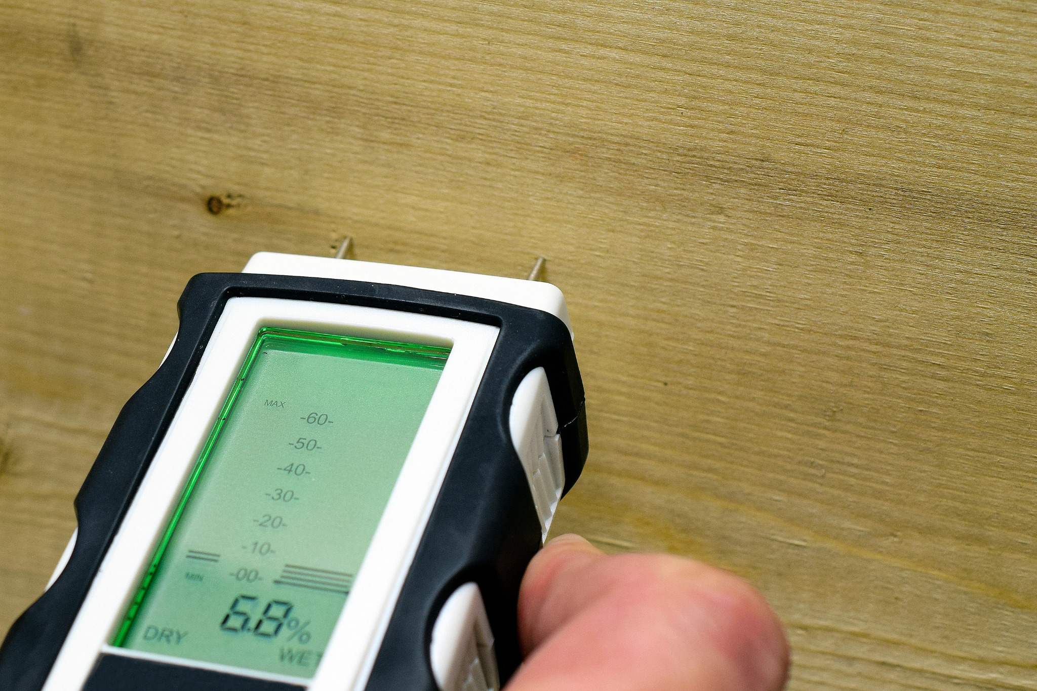 Best Time to Sand Floors – Finchley engineered oak hardwood floor checked with a pin moisture meter showing 6.8% MC to confirm safe sanding conditions.