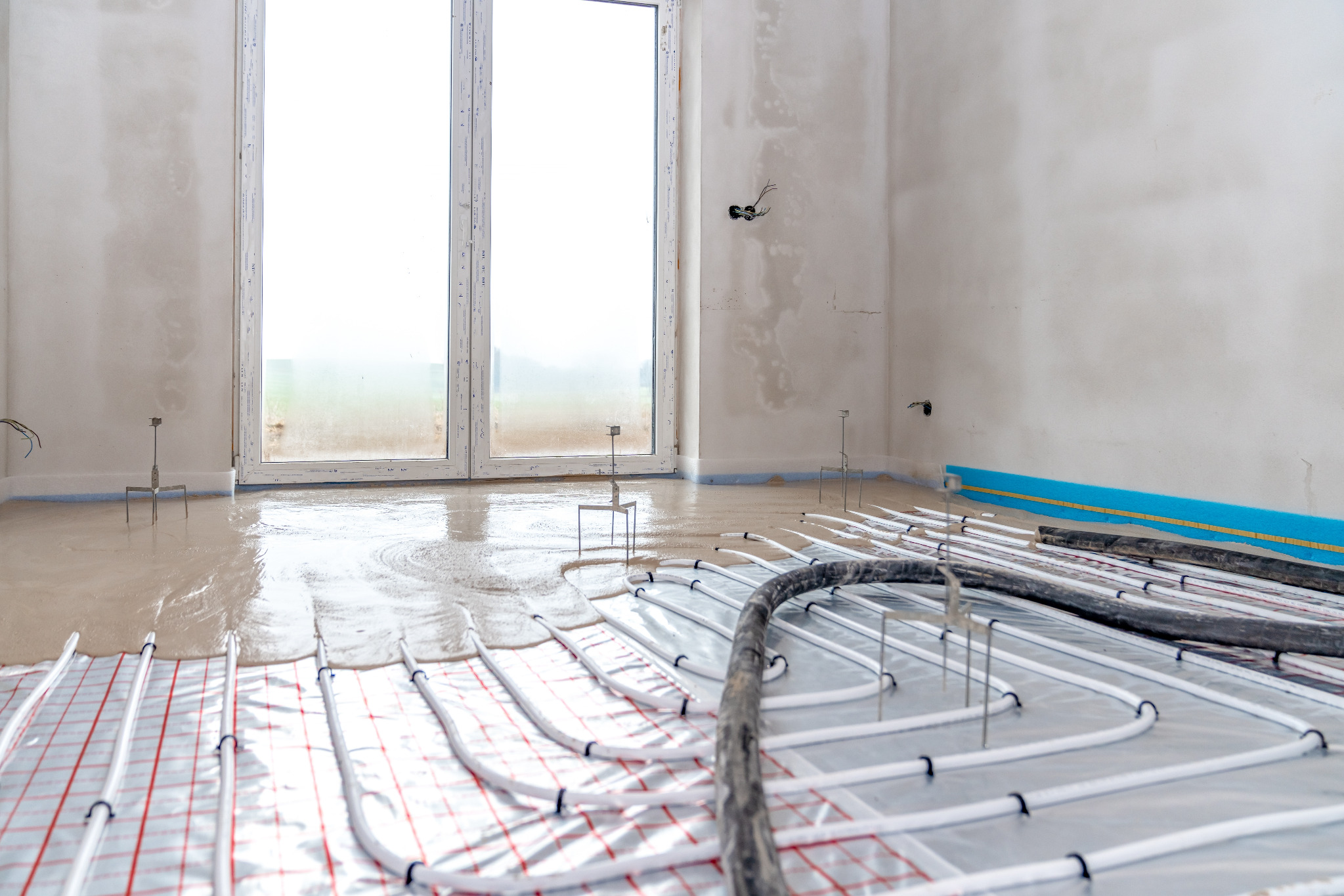 Best Time to Sand Floors – Finchley engineered oak herringbone parquet over underfloor heating, fresh screed curing before installation and final sanding.
